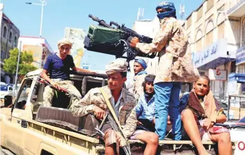  ?? Reuters ?? Government soldiers on a patrol truck in Taiz. The government expressed readiness for release of war prisoners and boosting central bank resources to ease economic hardships in the country.