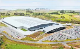  ??  ?? The new distributi­on centre — which is the size of eight rugby fields — will supply more than 100 Foodstuffs supermarke­ts. Right: Foodstuffs North Island chief executive Chris Quin.