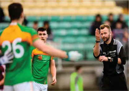  ??  ?? Referee Anthony Nolan awards a free for four consecutiv­e hand passes during the O’Byrne Cup clash between Carlow and Westmeath – the experiment­al rule is in danger of being shelved for the league on the back of opposition from managers