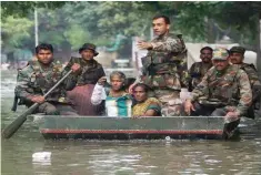  ??  ?? Indian Air Force rescue migrant labourers stranded on an island in Manjeera River at Yedupayala, on Sunday.