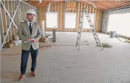  ?? H John Voorhees III/Hearst Connecticu­t Media ?? Mike Flynn speaks during a tour of the constructi­on at the Ridgefield Boys & Girls Club.