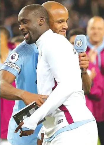  ??  ?? Captain Vincent Kompany pays tribute to Toure following the match against Brighton