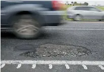  ?? Photo / Michael Cunningham ?? A decent-sized pothole on State Highway 1 near Oakleigh that was filled yesterday.