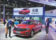  ?? LI FUSHENG / CHINA DAILY ?? A staffer cleans a Jetta-branded vehicle at Volkswagen’s booth at the Shanghai auto show in 2019.