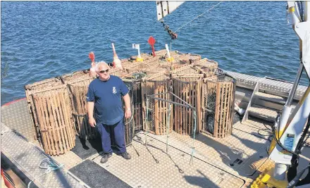  ?? SUBMITTED PHOTO ?? Captain Louis Callaghan of the Canadian Coast Guard Ship, S. Dudka, examining gear retrieved from lobster grounds off Prince Edward Island’s North Shore following the closure of the spring fishery.