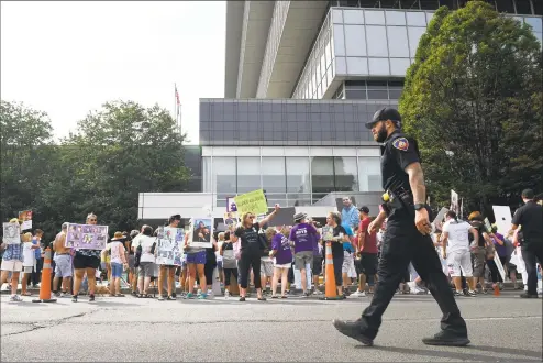  ?? Jessica Hill / Associated Press ?? Family and friends who have lost loved ones to OxyContin and opioid overdoses protest outside the Purdue Pharma headquarte­rs in Stamford on Aug. 17.