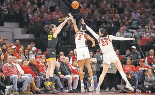  ?? KIRK IRWIN/GETTY IMAGES ?? Caitlin Clark launches a 3-point shot against Ohio State on Jan. 21. Clark has made a nation-leading 122 3-pointers.