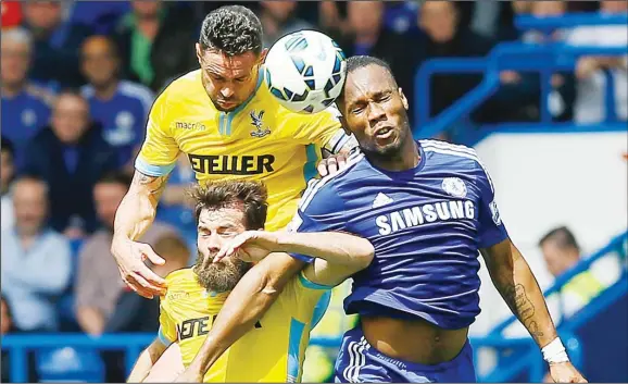  ??  ?? Chelsea’s Didier Drogba (right), battles for a header with Crystal Palace’s Joe Ledley (centre), and Damien Delaney during the English Premier League soccer match between Chelsea and Crystal Palace
at Stamford Bridge Stadium in London on May 3. (AP)
