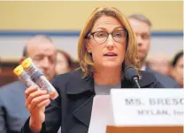  ?? PABLO MARTINEZ MONSIVAIS/ASSOCIATED PRESS ?? Mylan CEO Heather Bresch holds up an EpiPen while testifying on Capitol Hill on Wednesday before a House Oversight Committee hearing on EpiPen price increases.