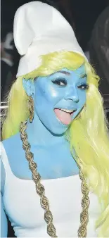  ?? MIKE COPPOLA/GETTY IMAGES ?? Ashanti was Smurfette at Heidi Klum’s 16th annual Halloween Party.