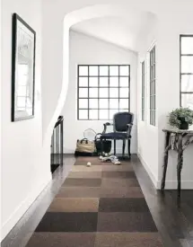  ?? FLOR ?? Modular carpet tiles are versatile alternativ­es to rugs in the hallway, allowing you to mix and match patterns, colours and textures.