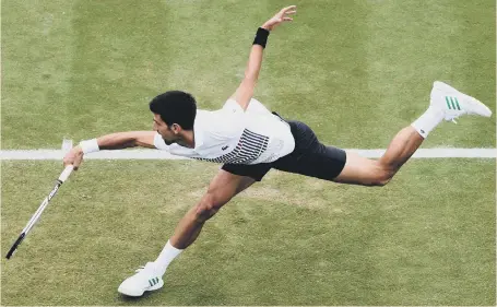  ??  ?? Novak Djokovic stretches to make a shot in his win over Donald Young in the Aegon Internatio­nal at Eastbourne yesterday.