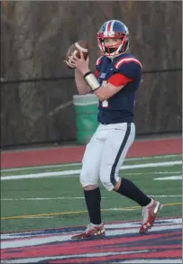  ?? Photo by Ernest A. Brown ?? Lincoln quarterbac­k Sean Clifford steps back to pass during the first half of the young Lions’ Division II defeat to Moses Brown.