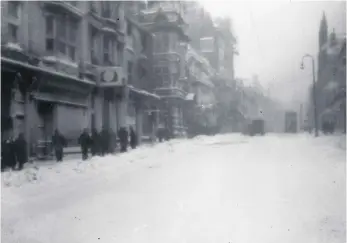  ??  ?? This scene shows people braving a blizzard in Fawcett Street.