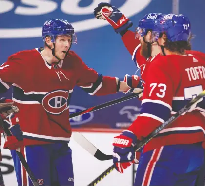  ?? ALLEN MCINNIS ?? Canadiens winger Corey Perry celebrates with his teammates on a night when the NHL veteran recorded his 800th career assist. The Canadiens downed the visiting Vancouver Canucks 6-2 at the Bell Centre to improve to 6-1-2 on the season.