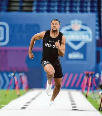  ?? Michael Conroy/Associated Press ?? Washington wide receiver Rome Odunze runs a drill at the NFL scouting combine in March.