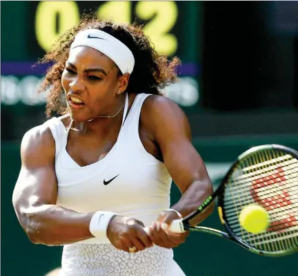  ?? Serena Williams of the United States returns a ball to Heather Watson of Britain during their singles match at the Wimbledon. PTI/AP ??