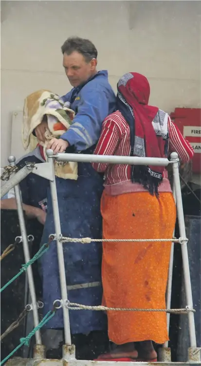  ??  ?? A photo taken on 5 November 2008 showing Chama Hatra and her daughter Muna disembarki­ng from a Russian vessel after being rescued at sea. A court ruled yesterday that Muna can be registered in Malta for humanitari­an reasons