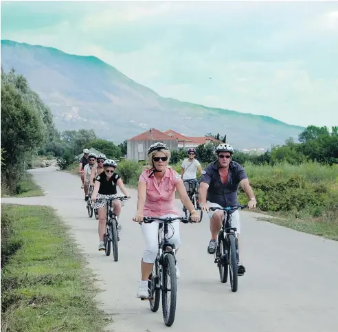  ?? PHOTOS: STEVE MACNAULL/POSTMEDIA NEWS ?? The Bike and Wine Adventure excursion tour group from the Disney Magic cruise ship cycles through the Konavle Valley just outside Dubrovnik, Croatia.