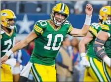  ?? MICHAEL AINSWORTH/AP PHOTO ?? Green Bay Packers quarterbac­k Jordan Love reacts after throwing a touchdown pass against the Dallas Cowboys during the second half of Sunday’s NFC wild-card playoff game in Arlington, Texas.