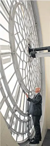  ??  ?? Steve Jaggs, keeper of the great clock of Westminste­r, is getting ready to supervise turning the hands back one hour for the end of British Summer Time