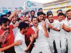  ?? PTI ?? Gujarat players celebrate after winning the Ranji Trophy at Holkar Stadium in Indore yesterday.