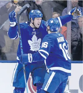  ?? NATHAN DENETTE / THE CANADIAN PRESS ?? Toronto Maple Leafs winger Matt Martin, left, is sharing fourth-line minutes with a “pretty special player” in Mitch Marner.