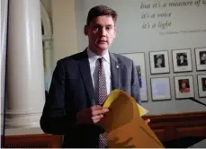  ?? CP PHOTO ?? Attorney General David Eby arrives to speak to media following the public engagement launch for next year’s provincial referendum on electoral reform during a press conference at the Legislatur­e in Victoria on Nov. 23, 2017.
