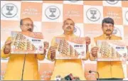  ?? HT PHOTO ?? (from left) BJP leaders Ashish Sood, Adesh Gupta and Manoj Tiwari release the ‘Vachan Patra’ on Thursday.