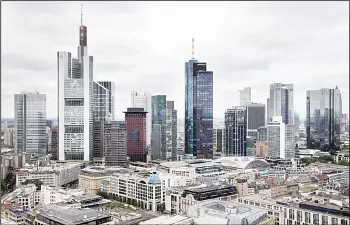  ??  ?? The skyline of Frankfurt am Main is pictured on Aug 22. While Britain has yet to trigger the two-year exit negotiatio­ns, corporatio­ns wary of the impact of a Brexit have begun scouting for alternativ­es to headquarte­r their European offices. Big banks...
