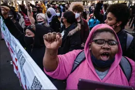  ?? (AP/Star Tribune/Richard Tsong-Taatarii) ?? “What they did to George Floyd was terrible,” said Shawna Harris, one of the protesters who marched in downtown Minneapoli­s on Monday to call for the conviction of former police officer Derek Chauvin.