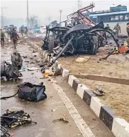  ??  ?? A scene of the spot after militants attacked a CRPF convoy in Goripora area of Awantipora town in Pulwama district on Thursday