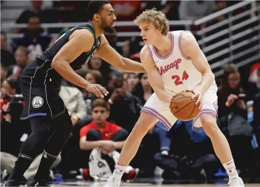  ?? JONATHAN DANIEL/GETTY IMAGES ?? Jabari Parker (guarding the Bulls’ Lauri Markkanen last season as a member of the Bucks) is an accomplish­ed scorer, but metrics show he is a subpar defender.