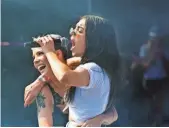  ??  ?? TIMOTHY HIATT, WIREIMAGE Charlie XCX, right, delighted attendees with surprise guest Halsey.