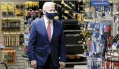  ?? AP photo ?? President Joe Biden on Tuesday visits W.S. Jenks & Son hardware store, a small business that received a Paycheck Protection Program loan.