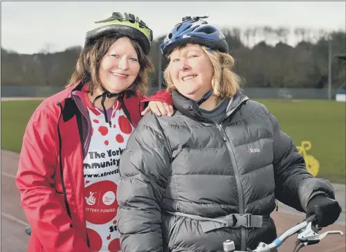  ??  ?? TANDEM CHALLENGE: Karen Brooke, right, will cycle from Germany to Huddersfie­ld to raise money for Yorkshire Air Ambulance. Gill Greaves, left, is one of her co-riders.