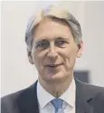  ??  ?? 0 Philip Hammond said he was focused on productivi­ty