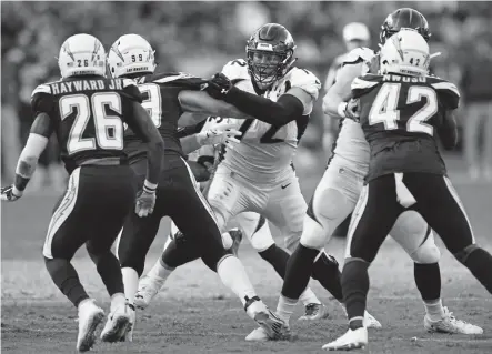  ?? Joe Amon, The Denver Post ?? Broncos offensive tackle Garett Bolles, blocking against the Los Angeles Chargers last Sunday, is the only member of the offensive line to start all 10 games this season.