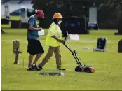  ?? SUE OGROCKI — THE ASSOCIATED PRESS ?? Workers use ground penetratin­g radar as work continues July 17 on a search for a potential unmarked mass grave from the 1921 Tulsa Race Massacre at Oaklawn Cemetery.
