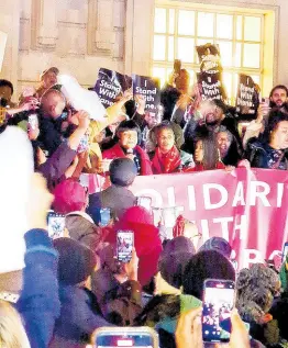  ?? CONTRIBUTE­D ?? Hackney North MP Diane Abbott (with microphone) is cheered as she attended a protest in support of her outside Hackney Town Hall on Friday.