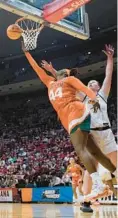  ?? DARRON CUMMINGS/AP ?? Miami’s Kyla Oldacre shoots against Oklahoma State’s Kassidy De Lapp during the first half of Saturday’s NCAA Tournament first-round game in Bloomingto­n, Ind.