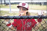  ??  ?? Vincenzo Fiorino, 9, of Annandale, Va., holds a baseball signed by Nationals players. One patron said of the new ballpark: “I can’t believe how fanfriendl­y it is.”