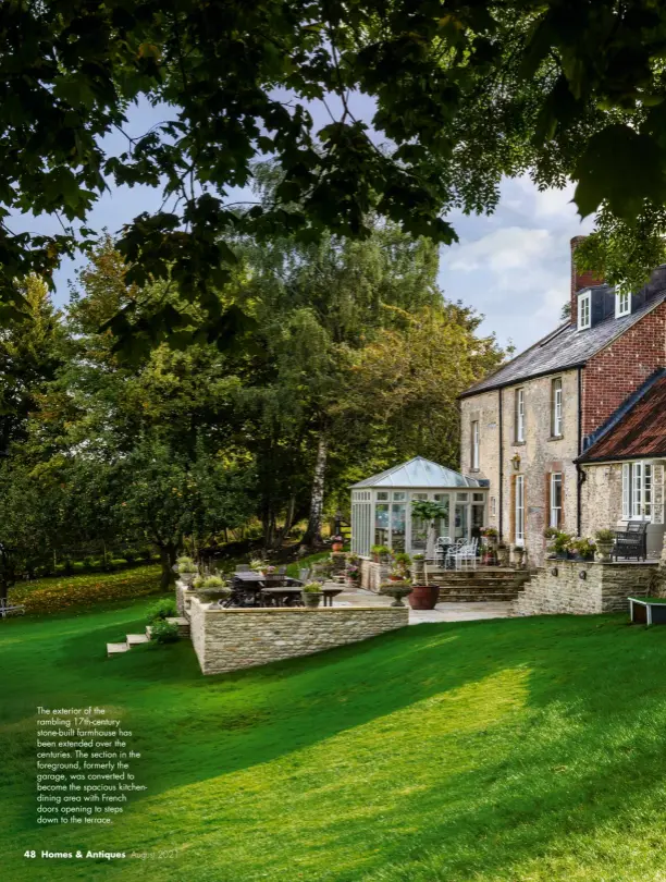  ??  ?? The exterior of the rambling 17th-century stone-built farmhouse has been extended over the centuries. The section in the foreground, formerly the garage, was converted to become the spacious kitchendin­ing area with French doors opening to steps down to the terrace.