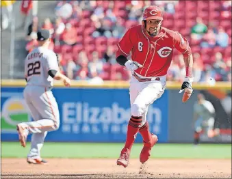  ?? [MICHAEL E. KEATING/THE ASSOCIATED PRESS] ?? The Reds’ Billy Hamilton heads for home from second base on an Eugenio Suarez single in the first inning.