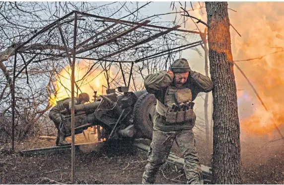  ?? ?? Firing line Ukrainian troops from the 10th Separate Mountain Assault Brigade in action against Russian forces trying to capture the eastern city of Bakhmut.