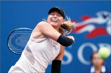  ?? AP PHOTO BY ADAM HUNGER ?? Maria Sharapova, of Russia, returns a shot from Timea Babos, of Hungary, during the second round of the U.S. Open Wednesday in New York.