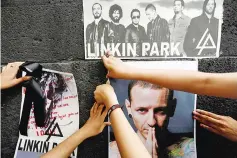  ??  ?? Fans stick posters as they gather at Revolucion monument to pay tribute to Bennington, following the singer's death, in Mexico City, Mexico, recently. — Reuters file photo
