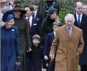  ?? KIRSTY WIGGLESWOR­TH/ASSOCIATED PRESS ?? King Charles III, center right, and Camilla, the Queen Consort, lead the Royal Family as they arrive to attend the Christmas day service at St Mary Magdalene Church in Sandringha­m in Norfolk, England, Sunday, Dec. 25, 2022.