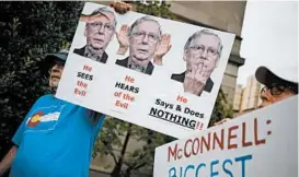  ?? LUKE SHARRETT/GETTY ?? Activists demonstrat­e outside Mitch McConnell’s office this week in Louisville, Kentucky.