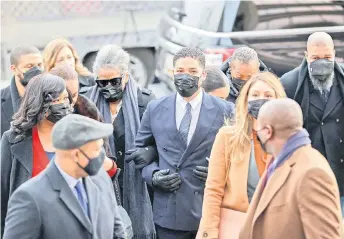  ?? — AFP photo ?? Smollett (centre) arrives at the Leighton Criminal Court Building for the beginning of his trial on new disorderly conduct charges on in Chicago, Illinois.